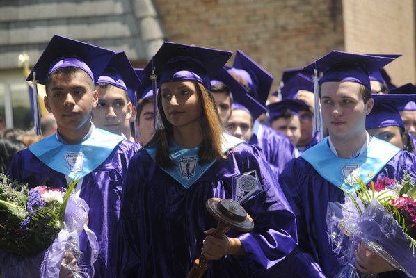 From left: Valedictorian Erik Morastitla, Class President Alexandra Macholz, and Salutatorian Nicholas Kolb graduated on Saturday afternoon. AMANDA BERNOCCO