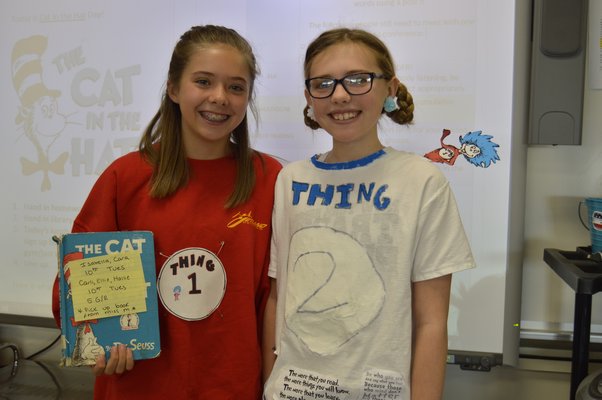 Tuckahoe School sixth-grade students Ellie Hattrick, left, and Hallie Beeker dress up as Thing 1 and Thing 2 from "The Cat in the Hat" to celebrate Dr. Seuss Week at the school. ALYSSA MELILLO