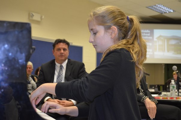 Rebecca Nelsen, a seventh-grader at Eastport South Manor Junior-Senior High School, performed for the Board of Education at last month's meeting. ALEXA GORMAN