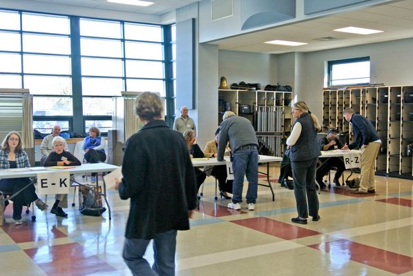 Voters at the polls at Southampton Intermediate School on Tuesday morning.  DANA SHAW