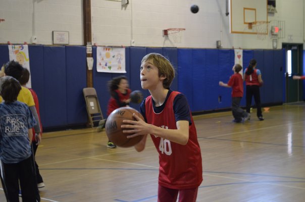 Fifth-grader Brandon Cirincione participated in the annual "Hoops for Heart" fundraiser at East Quogue Elementary School on Friday. ALEXA GORMAN