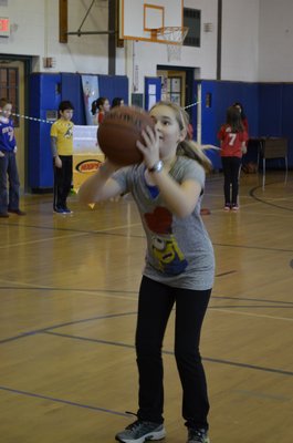 Fifth-grader Ali Jedlicka participated in the annual "Hoops for Heart" fundraiser at East Quogue Elementary School on Friday. ALEXA GORMAN