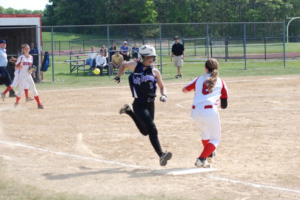 Hampton Bays freshman Katie Picataggio beat the throw to the bag but was called out by the umpire. DREW BUDD