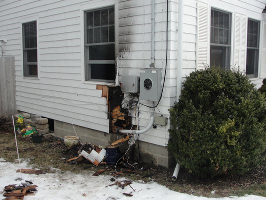 An electrical fire stemming from an electric box on the side of a Southampton Village home broke out on Saturday morning, but was put out within 45 minutes. COURTESY THE SOUTHAMPTON FIRE DEPARTMENT