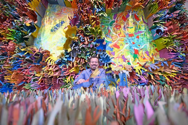 Artist Francisco Alvarado-Juárez among some of the 5,000 paper bags that make up part of“Light of the Ocean” at the Southampton Arts Center.      DANA SHAW