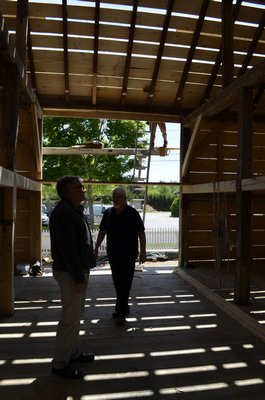 Photographer Ulf Skogsbergh and Historical Museum Director Tom Edmonds in the refurbished barn. BY ERIN MCKINLEY