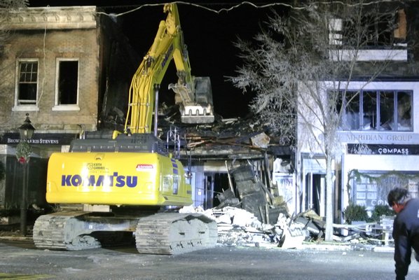 The Sag Harbor Cinema was demolished on Friday night. Crews managed to salvage the sign.   DANA SHAW
