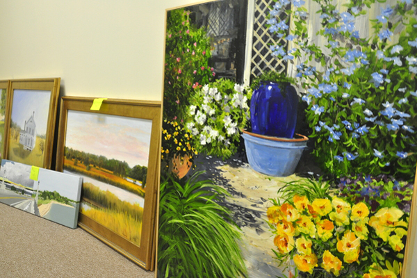 Art ready for auction at "Art in the Garden," sponsored by the Queen of the Most Holy Rosary Church in Bridgehampton this weekend. MICHELLE TRAURING
