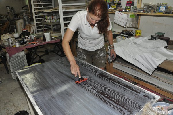 Heather Dunn makes faux bois wallpaper in her East Hampton studio. MICHELLE TRAURING