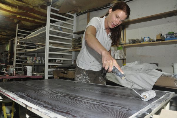 Heather Dunn makes faux bois wallpaper in her East Hampton studio. MICHELLE TRAURING