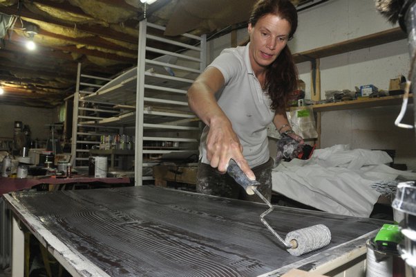 Heather Dunn makes faux bois wallpaper in her East Hampton studio. MICHELLE TRAURING