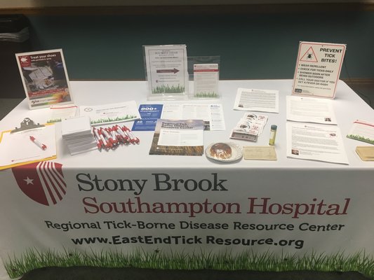 A table of information given out by Southampton Stony Brook Hospital at the Tick Talk at Hampton Bays Public Library on July 11. JULIA HEMING
