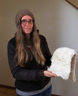 Rachel Stephens showing off a hand-crafted scarf she made from homegrown wool. She also made the hat she’s wearing. LISA DAFFY
