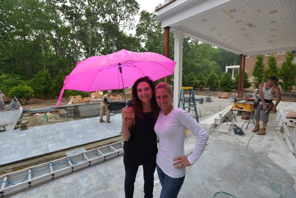 Iris Dankner and Jennifer Duneier push through to finish Holiday House Hamptons despite the fact that the weather wasn't cooperating. ALEX GOETZFRIED