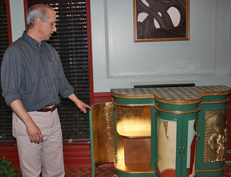 Manorville artist Joe Fratello with a Renaissance art-inspired cabinet he made. JESSICA DINAPOLI