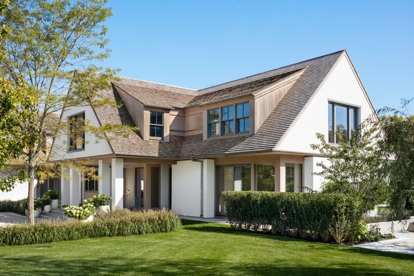 The play of dormers set against gabled end walls.