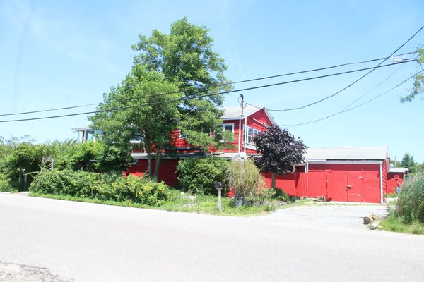 The iconic barn red former Lobster Grill Inn is transforming into Manna Waterfront Restaurant and Bar. PEGGY SPELLMAN HOEY