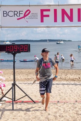 6-Mile Race Winner Michael Fithian crosses the finish line during the annual Paddle for Pink at Havens Beach on Saturday morning.