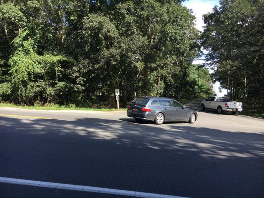 The proposed car wash would be built on the wooded lot between the entrance and exit roads to the East Hampton Town recycling center on Springs Fireplace Road.