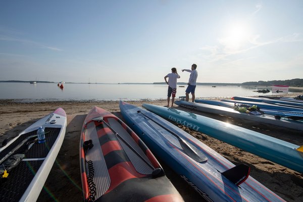 Zach and Jim Rothwell prepare for their paddle prior to the start of the annual Paddle for Pink at Havens Beach on Saturday morning.