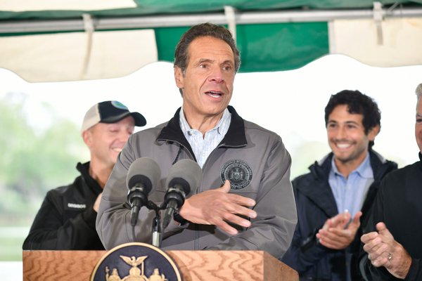 Governor Andrew Cuomo speaks at a press conference in Southampton Village on Thursday announcing a pilot program to clean up Lake Agawam.    DANA SHAW