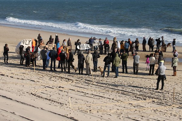 Protesters rallied on a Montauk beach on Sunday to demand an end to the Downtown Montauk Emergency Stabilization Project. KYRIL BROMLEY