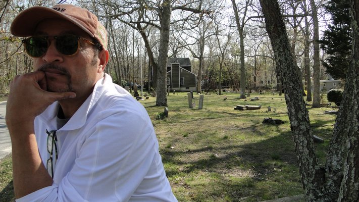 Eastville Community Historical Society Chairman Michael Butler at the African Methodist Episcopal Zion Cemetery in Sag Harbor on Friday. By COLLEEN REYNOLDS