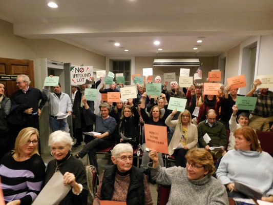 Residents held up signs that said 