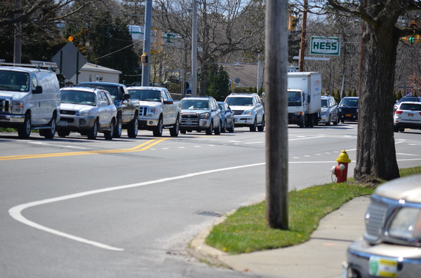 A line of cars traveling eastbound on Montauk Highway wait in traffic due to the Long Island Rail Road bridge construction project. ERIN MCKINLEY