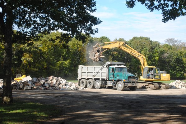Bulldozers are demolishing the old VFW Post in Quogue. AMANDA BERNOCCO