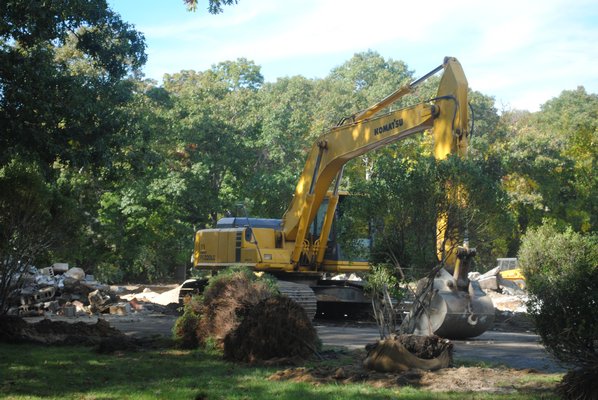 A bulldozer is at the site of the old VFW Post in Quogue that is being demolished. AMANDA BERNOCCO