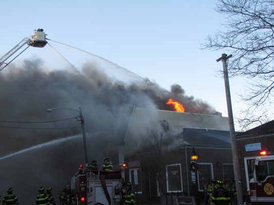 Multiple fire departments and ambulance companies are on the scene of a massive fire on Sag Harbor Main Street Friday morning. BY MICHAEL WRIGHT