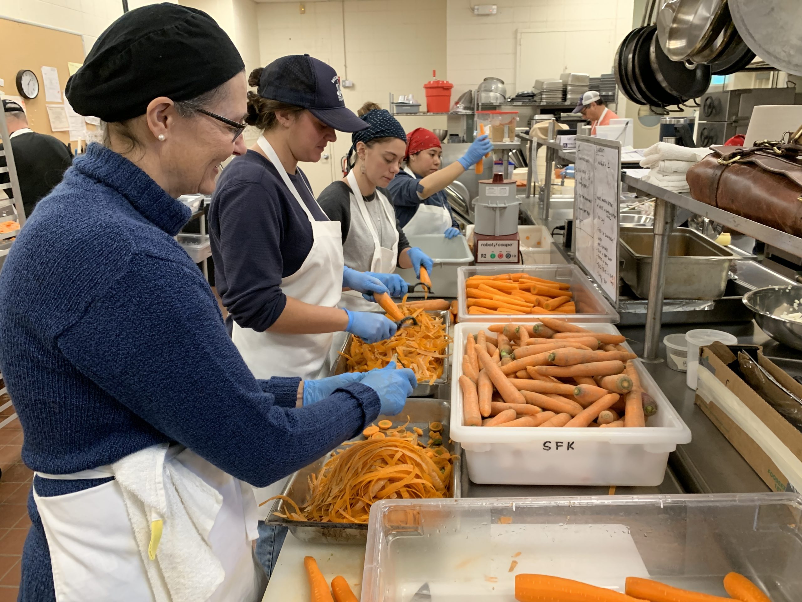Volunteers helped wash, peel, chop and freeze 1,600 pounds of carrots to be sent to a food bank. KIM COVELL