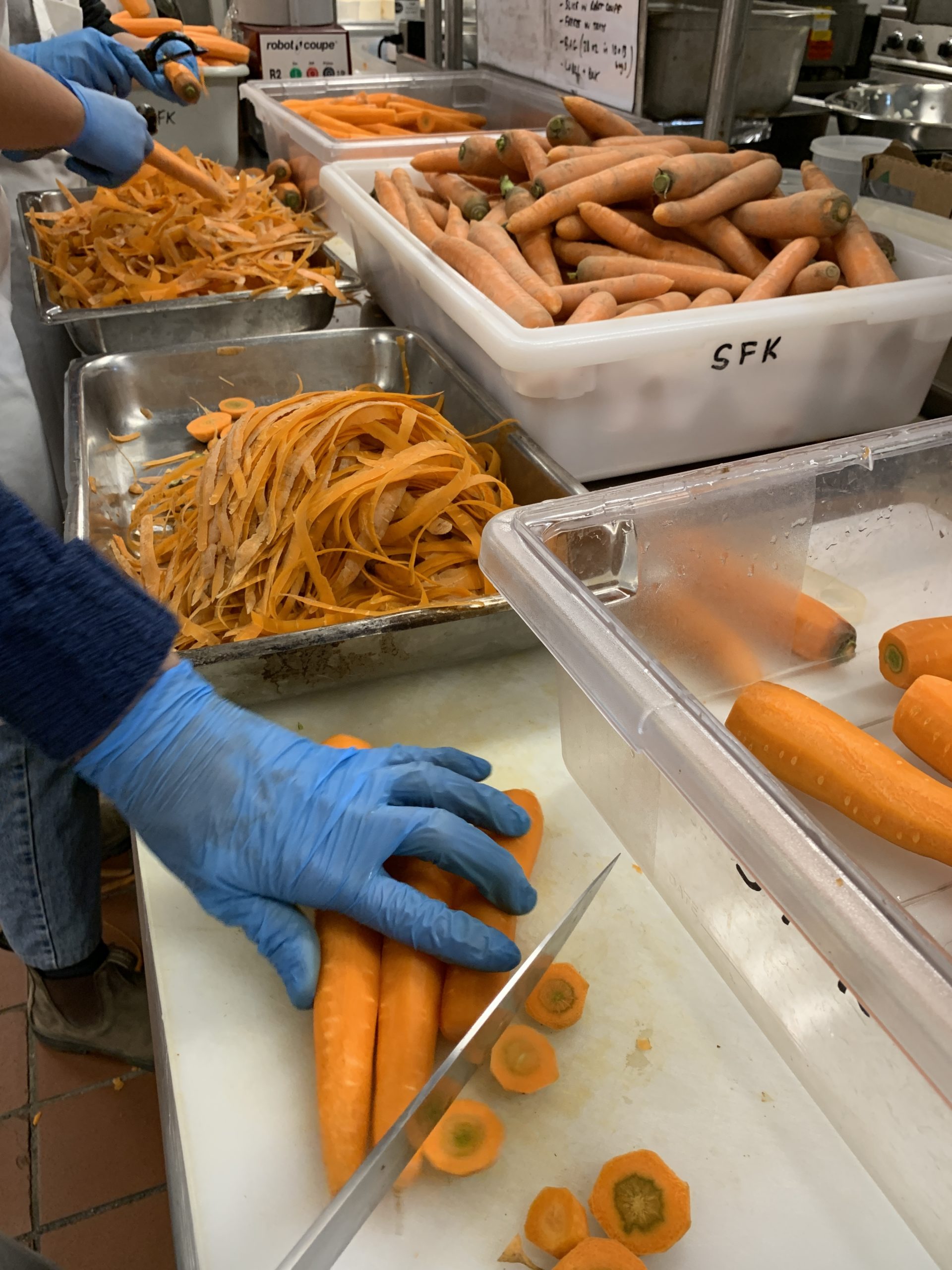 Volunteers helped wash, peel, chop and freeze 1,600 pounds of carrots to be sent to a food bank. KIM COVELL