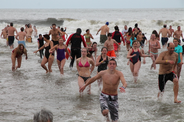 Swimmers wait for the start of the Polar Plunge at Atlantic Avenue Beach in Amagansett on Tuesday. KYRIL BROMLEY