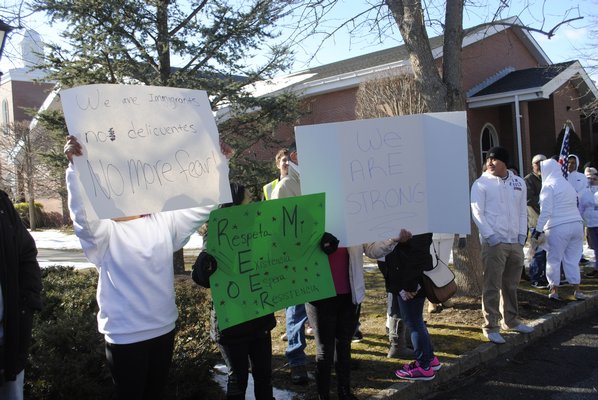 Hundreds of people protested in Hampton Bays on Thursday afternoon. AMANDA BERNOCCO
