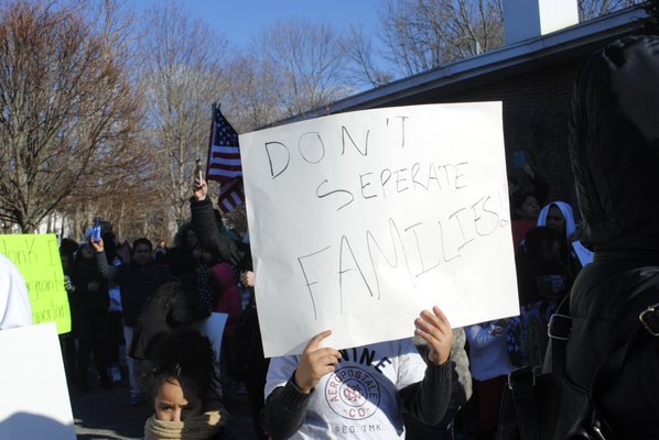 Hundreds of people protested
 in Hampton Bays on Thursday afternoon. AMANDA BERNOCCO