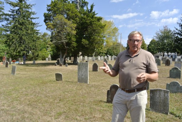 Southampton Historical Society Executive Director Tom Edmonds in the North End Graveyard and Burial Ground in Southampton Village.  DANA SHAW