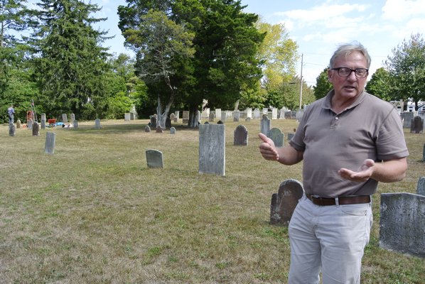 Southampton Historical Society Executive Director Tom Edmonds in the North End Graveyard and Burial Ground in Southampton Village.  DANA SHAW