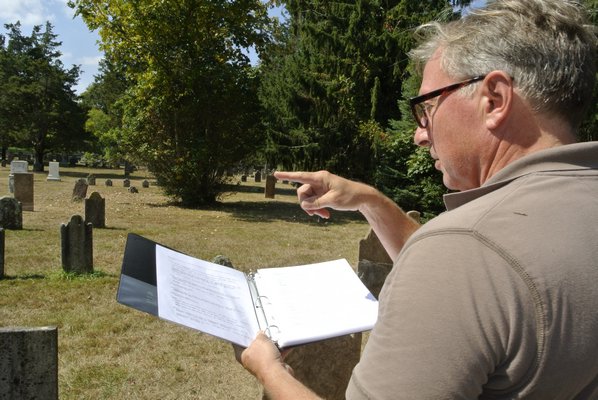 Tom Edmonds goes over the list of those interred in the North End Graveyard and Bu