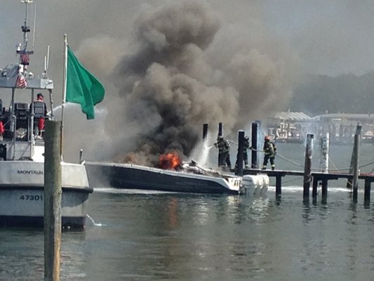 A boat caught fire in Montauk Harbor Saturday afternoon. VIRGINIA GARRISON