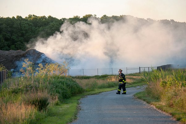Firefighters respond to a mulch fire in East Hampton early this morning MICHAEL HELLER