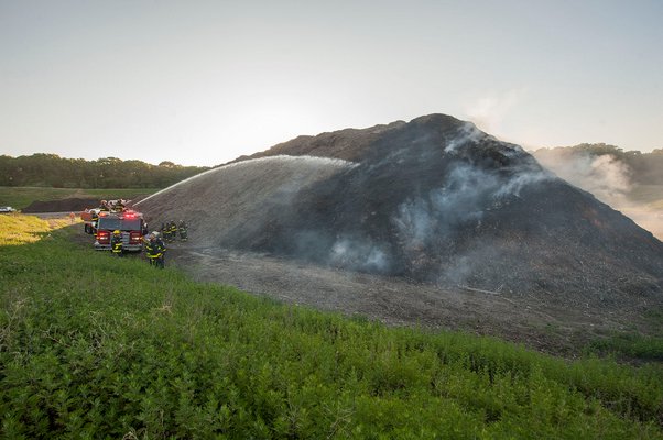 Firefighters respond to a mulch fire in East Hampton early this morning MICHAEL HELLER