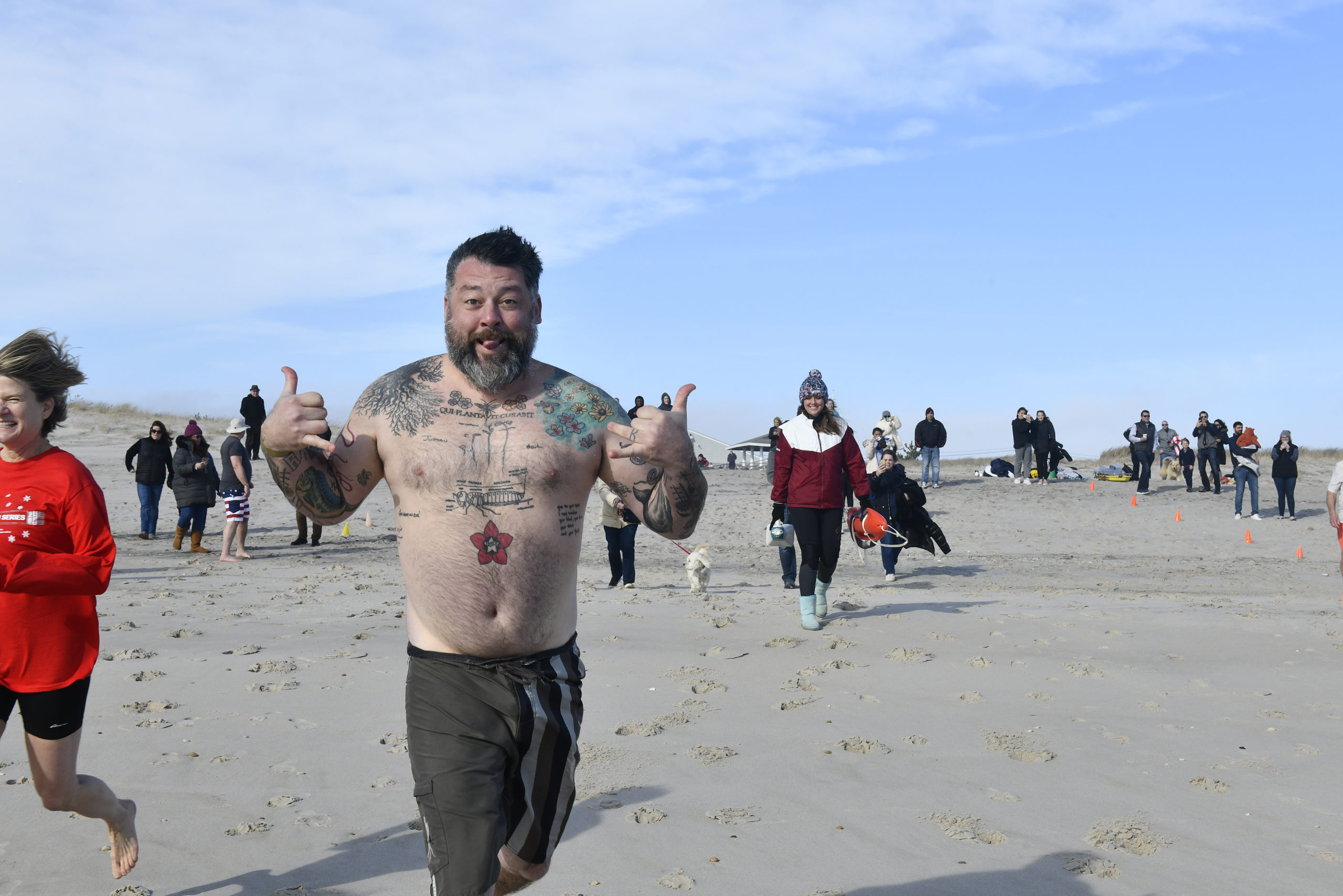 Westhampton Beach Village Trustee Brian Tymann heads into the water.