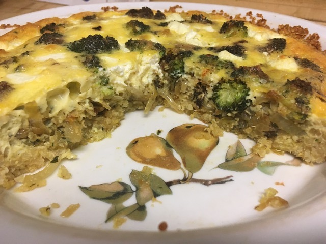 Broccoli and caramelized onion quiche with quinoa crust. 