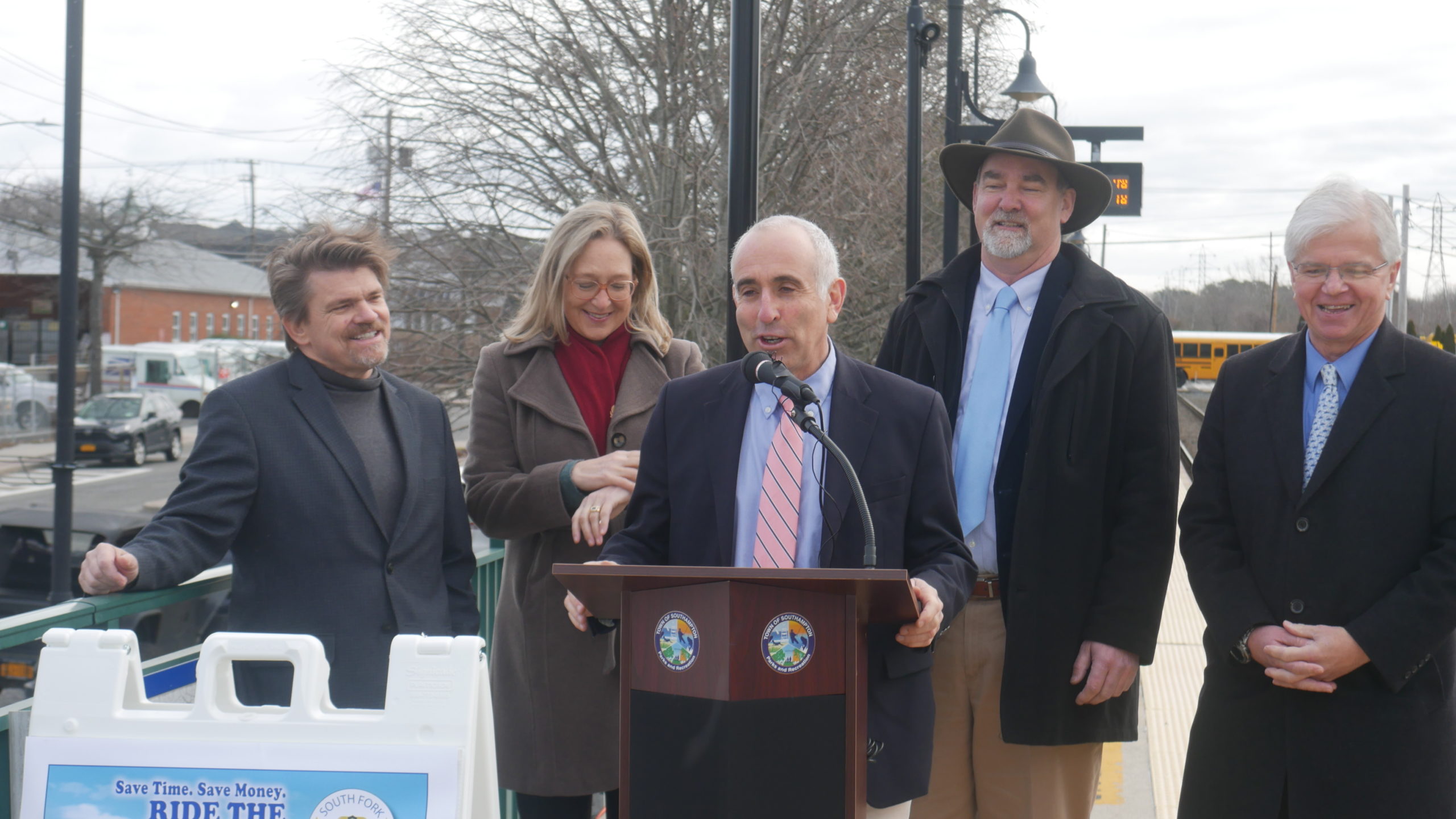 Southampton Town Supervisor Jay Schneiderman discusses the success of the South Fork Commuter Connection as Southampton Town Councilman Tommy John Schiavoni, Suffolk County Legislator Bridget Fleming, East Hampton Town Supervisor Peter Van Scoyoc, and Assemblyman Fred W. Thiele Jr. look on. CONNIE CONWAY