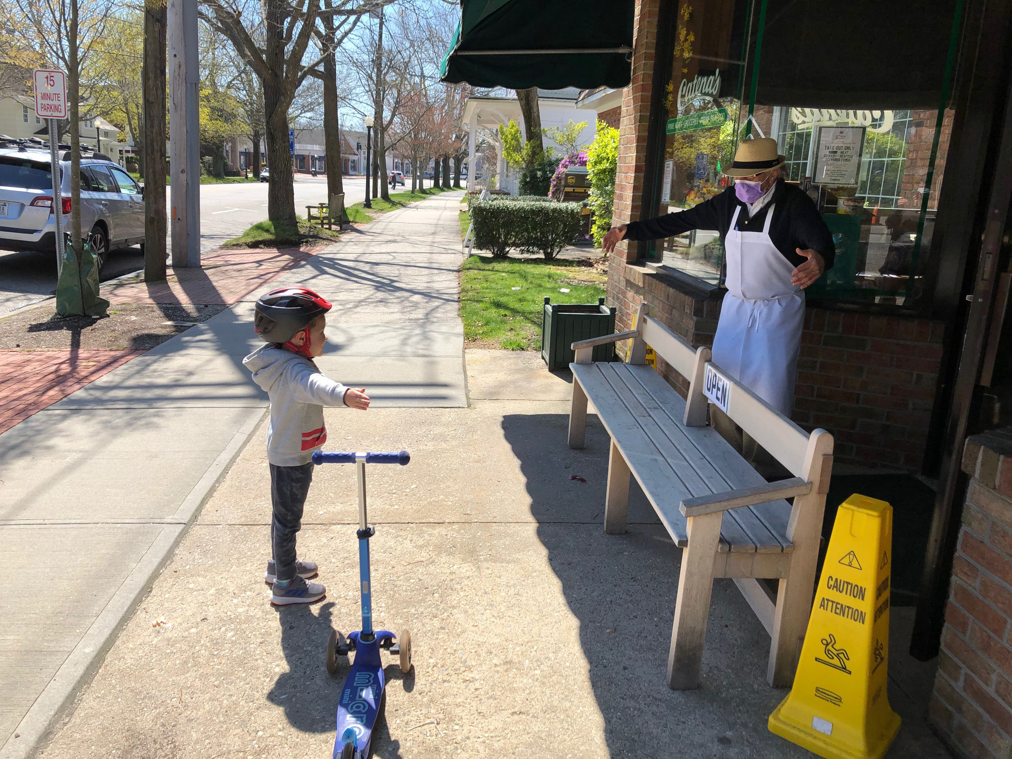 Mary Crosby recenly captured this photo of her dad, Vic Finalborgo, air hugging his grandson  Caleb Crosby outside of Catena’s Market in Southampton Village.   MARY CROSBY