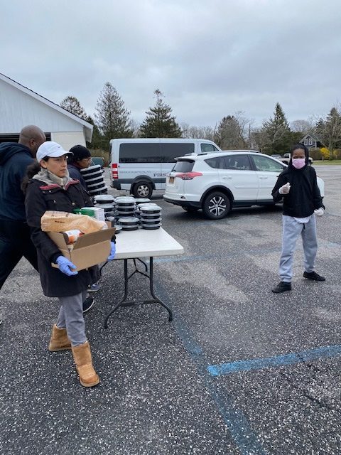 Volunteers prepare to distribute food. COURTESY HAMPTONS ART CAMP