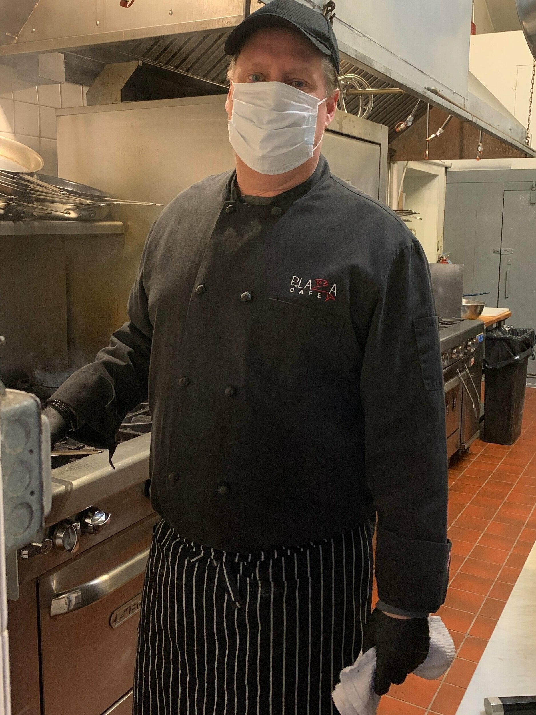 Doug Dulija, chef and owner of The Plaza Cafe in Southampton, suited up for a day in the kitchen.