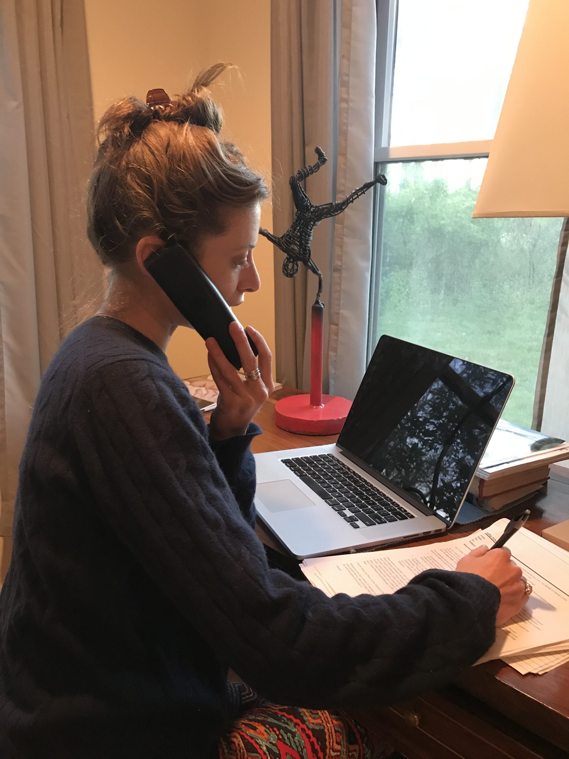 Julia, a volunteer for The Retreat, answers a call on the 24-hour emergency hotline.